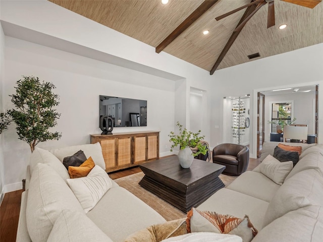 living room featuring ceiling fan, high vaulted ceiling, wood-type flooring, wooden ceiling, and beamed ceiling