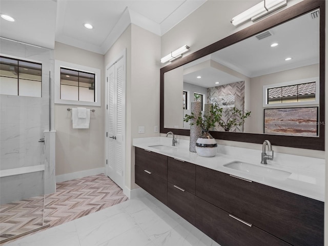 bathroom featuring vanity, tiled shower, and crown molding