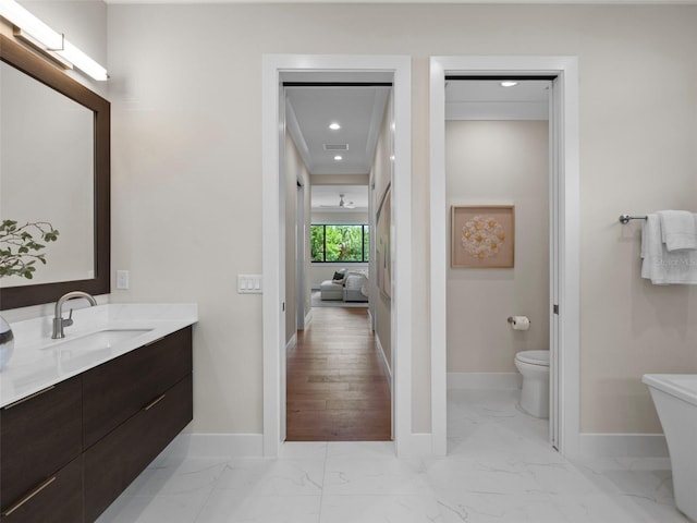 bathroom with vanity and toilet