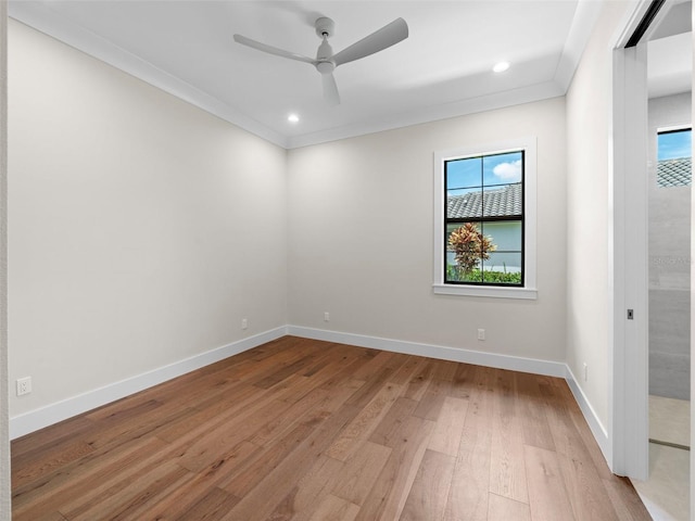 unfurnished room with crown molding, ceiling fan, and light hardwood / wood-style floors