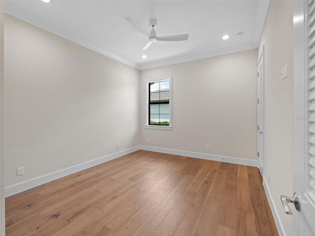 spare room with crown molding, light hardwood / wood-style flooring, and ceiling fan