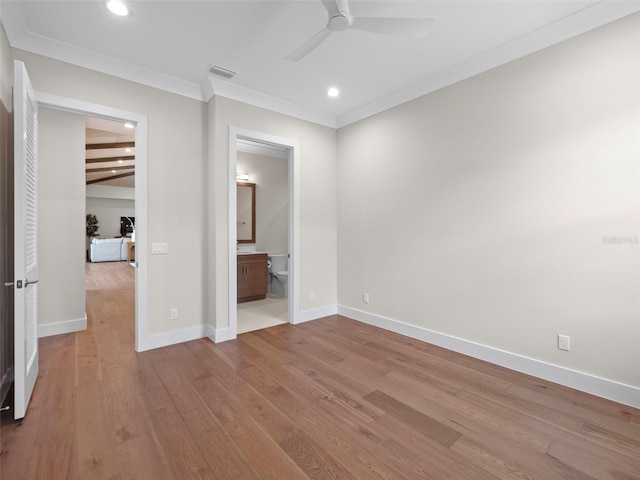 unfurnished bedroom featuring crown molding, ensuite bathroom, ceiling fan, and light hardwood / wood-style floors