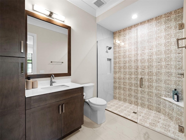 bathroom with vanity, toilet, and an enclosed shower