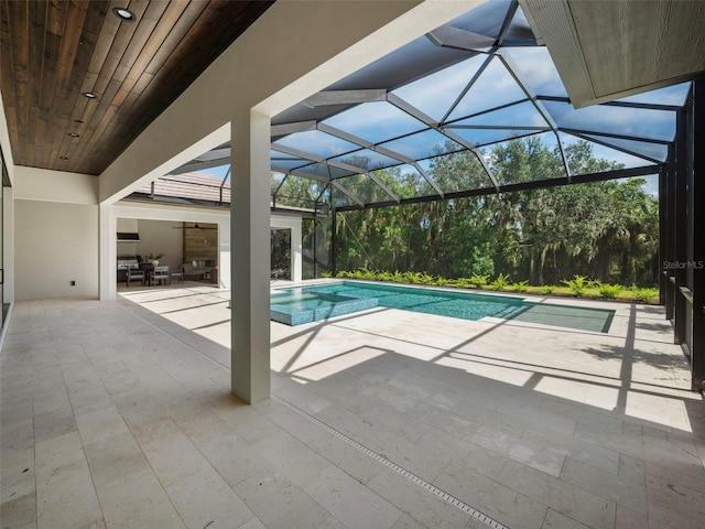 view of pool featuring a lanai and a patio area