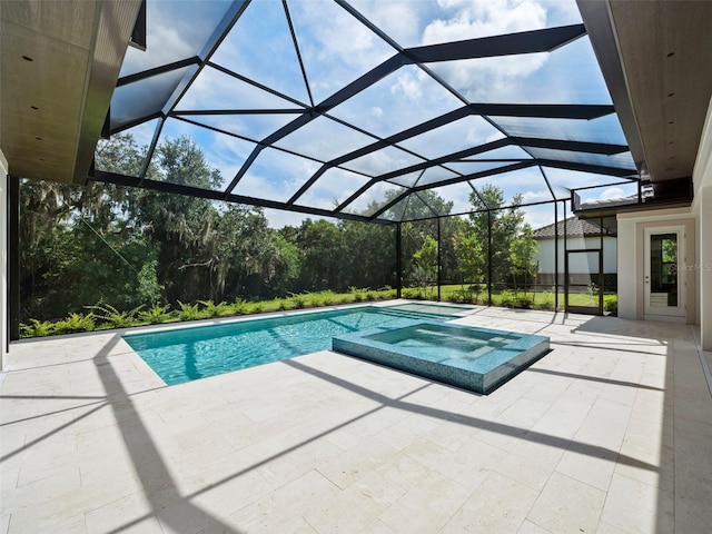 view of swimming pool featuring an in ground hot tub, a lanai, and a patio area