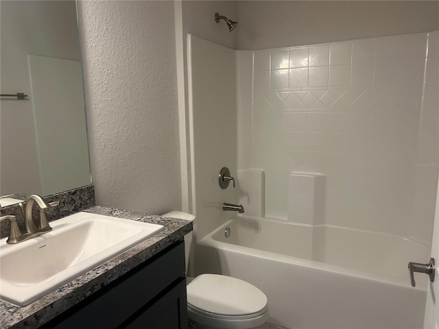 full bathroom with vanity, shower / bathtub combination, and toilet