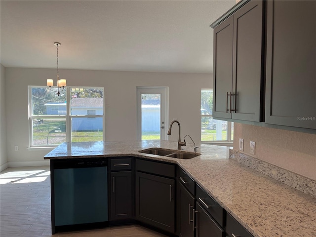 kitchen with an inviting chandelier, sink, hanging light fixtures, stainless steel dishwasher, and light stone countertops