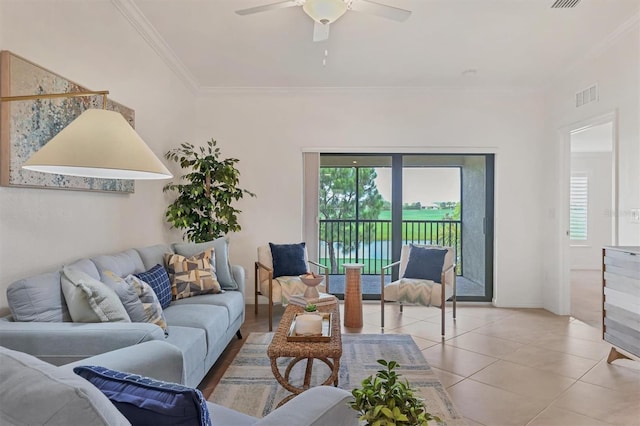 tiled living room with ceiling fan and ornamental molding