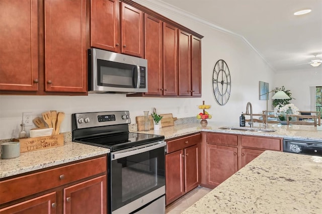 kitchen featuring light stone countertops, sink, ornamental molding, and stainless steel appliances