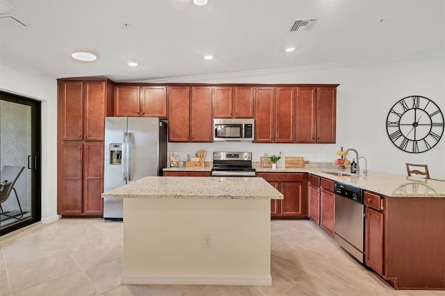 kitchen with light stone counters, crown molding, sink, and appliances with stainless steel finishes