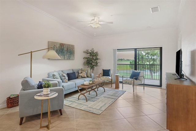 tiled living room with ceiling fan and ornamental molding