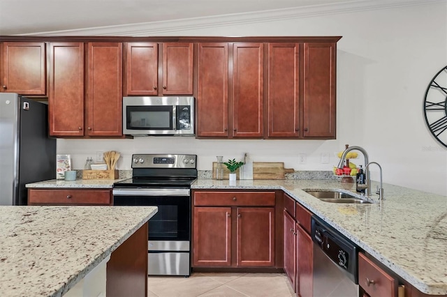 kitchen featuring light stone countertops, sink, ornamental molding, and appliances with stainless steel finishes