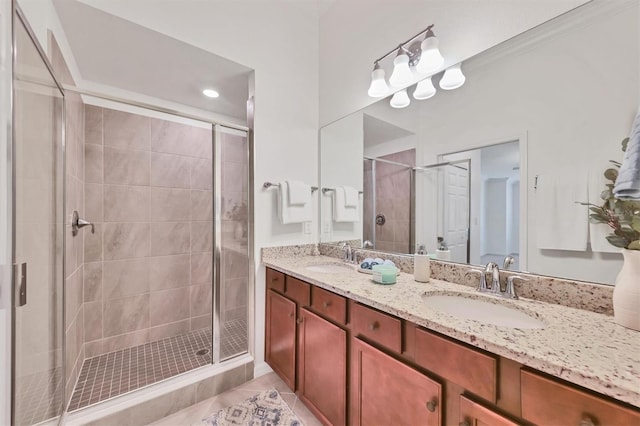 bathroom with tile patterned flooring, vanity, an enclosed shower, and crown molding