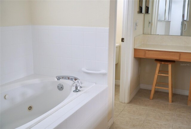 255 Royal Palm Dr, Davenport, FL 33837 - full bath with a tub with jets and tile patterned floors