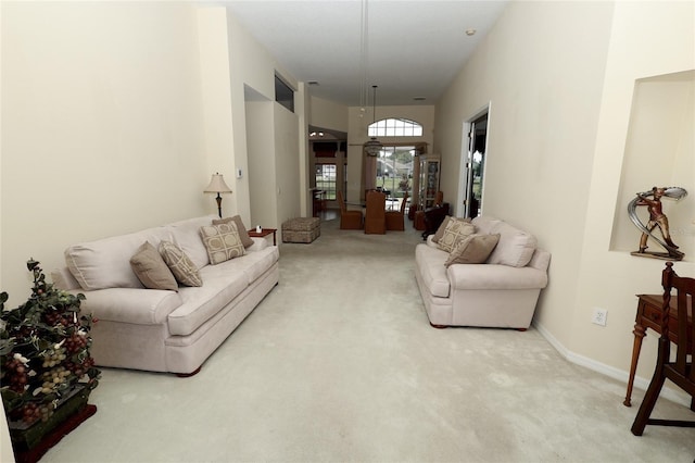 255 Royal Palm Dr, Davenport, FL 33837 - living room featuring baseboards and light colored carpet