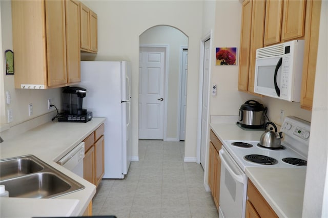 255 Royal Palm Dr, Davenport, FL 33837 - kitchen featuring white appliances, light brown cabinets, and light countertops