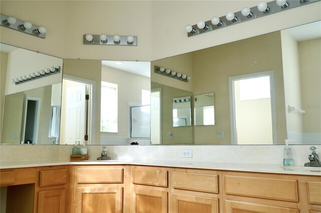 255 Royal Palm Dr, Davenport, FL 33837 - bathroom featuring double vanity, a sink, and a shower with shower door