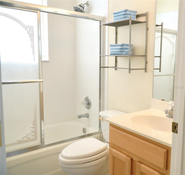 255 Royal Palm Dr, Davenport, FL 33837 - bathroom featuring toilet, combined bath / shower with glass door, and vanity