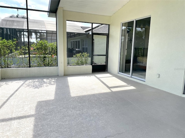 255 Royal Palm Dr, Davenport, FL 33837 - unfurnished sunroom featuring lofted ceiling and plenty of natural light