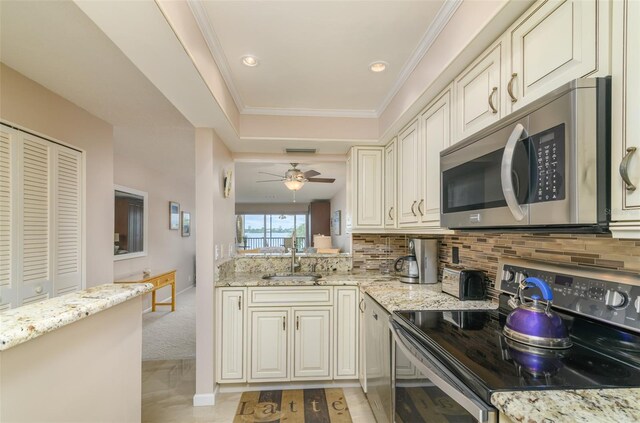 kitchen with tasteful backsplash, light stone countertops, ceiling fan, and electric range oven