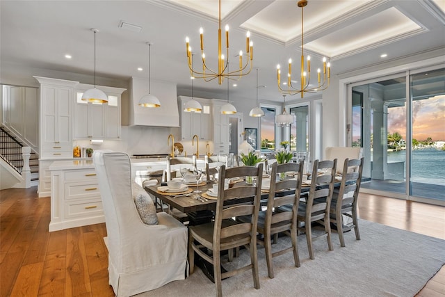 dining area featuring light wood-type flooring, a wealth of natural light, and an inviting chandelier