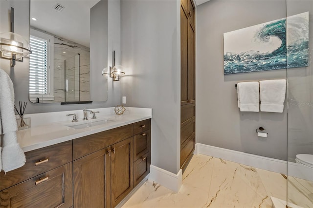 bathroom featuring vanity and an enclosed shower