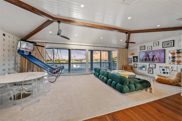 living room featuring hardwood / wood-style floors, lofted ceiling with beams, and ceiling fan