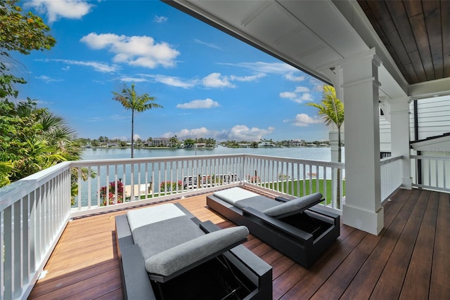 wooden deck featuring a water view