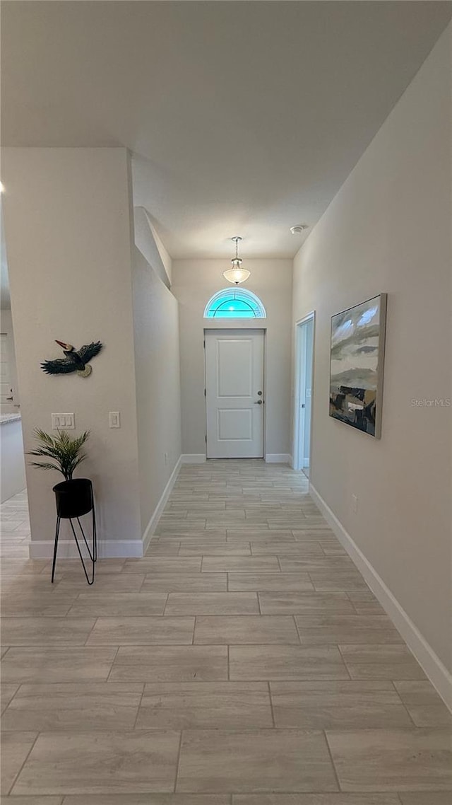 interior space with wood tiled floor and baseboards