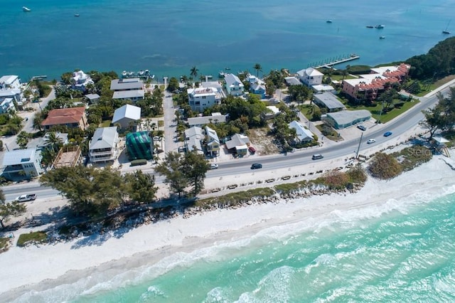 bird's eye view with a water view and a view of the beach