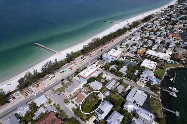 birds eye view of property with a residential view, a view of the beach, and a water view
