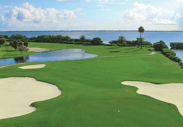 surrounding community featuring a water view