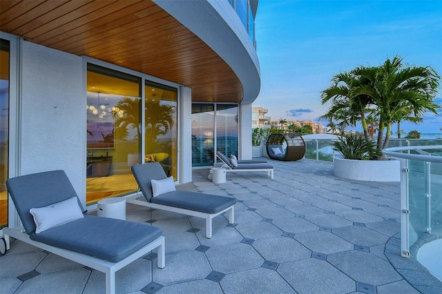 patio terrace at dusk with a balcony