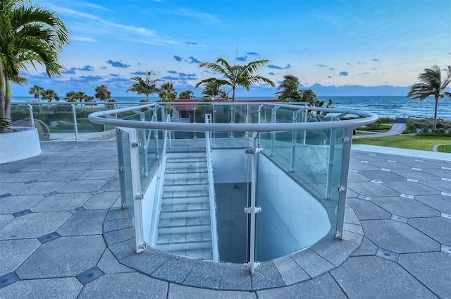 view of pool featuring a water view