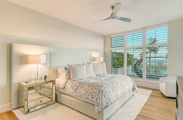 bedroom featuring ceiling fan and light wood-type flooring