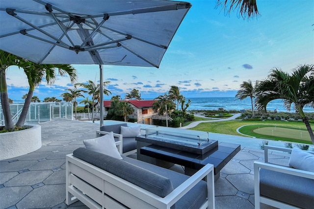 view of patio with an outdoor hangout area and a water view