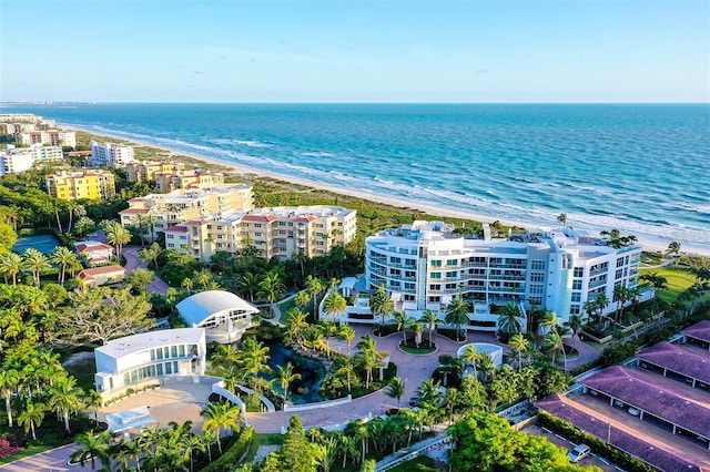 aerial view featuring a water view and a beach view