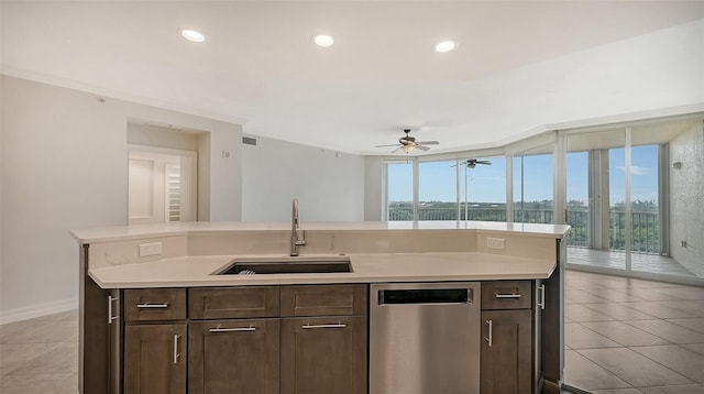 kitchen featuring a wealth of natural light, stainless steel dishwasher, ceiling fan, and sink