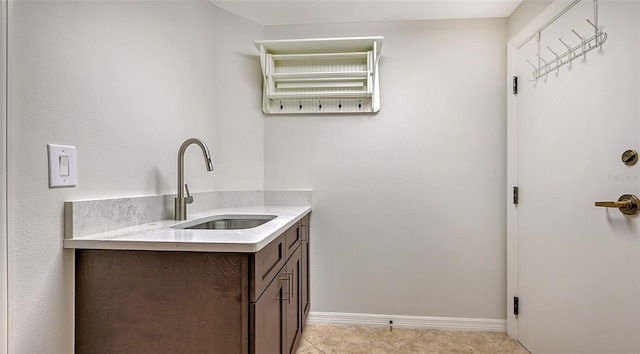 bathroom with tile floors and sink