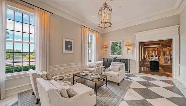 living area with a chandelier, a wealth of natural light, light tile floors, and crown molding