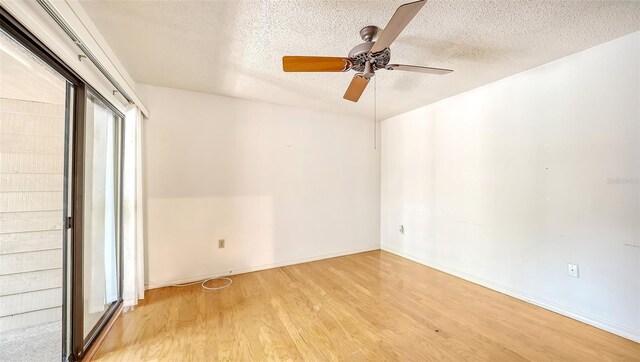 empty room featuring ceiling fan, a textured ceiling, and light hardwood / wood-style flooring