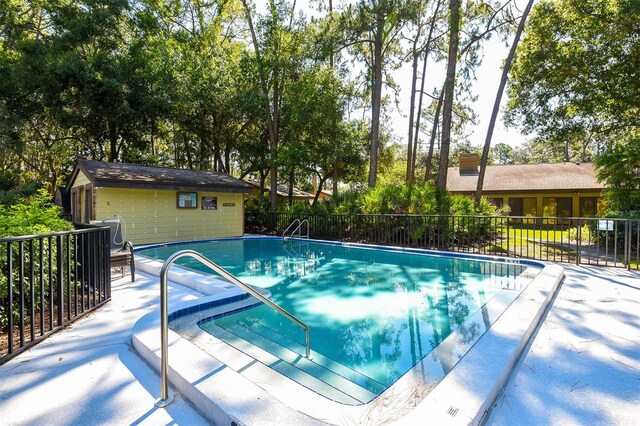 view of pool featuring area for grilling