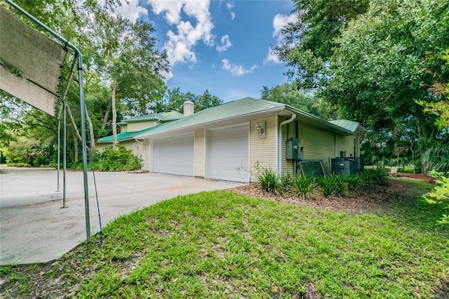 view of side of home featuring a garage