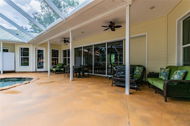 view of terrace with outdoor lounge area, ceiling fan, and glass enclosure