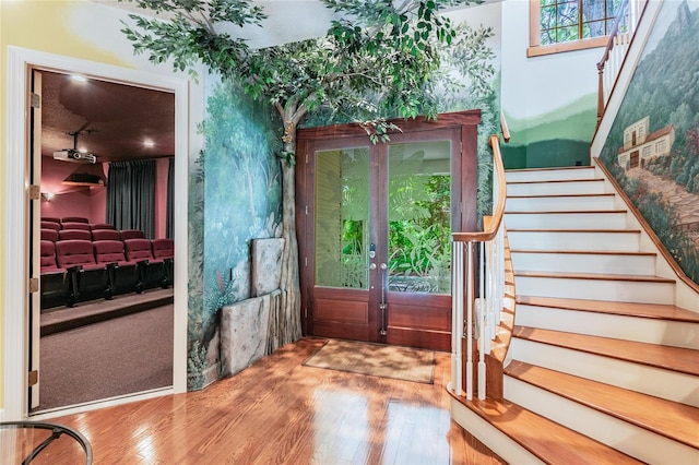 foyer featuring light hardwood / wood-style flooring and french doors