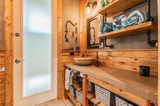 bathroom featuring tile floors and vanity