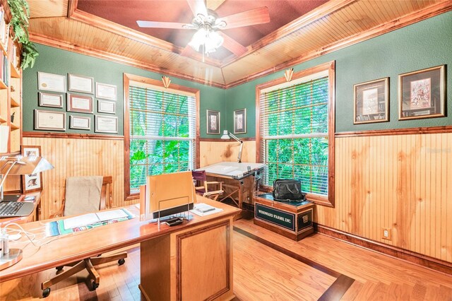 office with wooden ceiling, ceiling fan, ornamental molding, and a tray ceiling