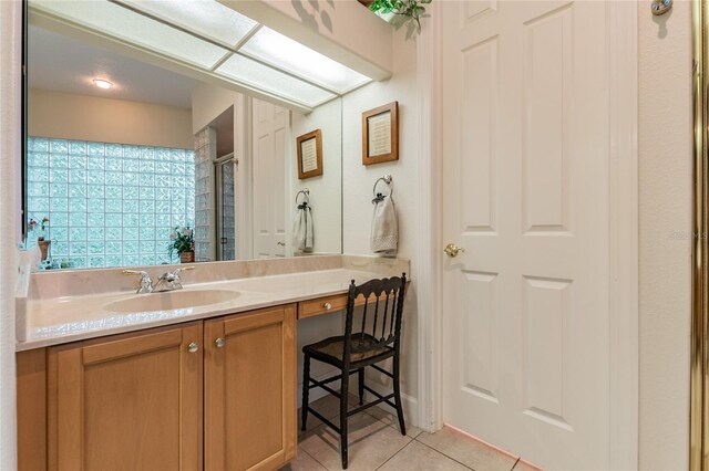 bathroom with tile floors and vanity