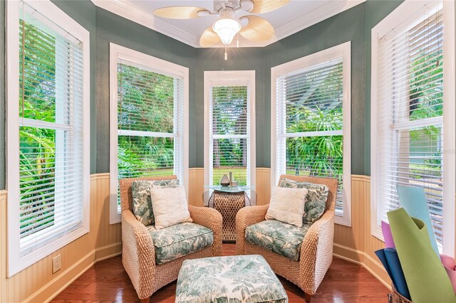 sunroom with a healthy amount of sunlight and ceiling fan