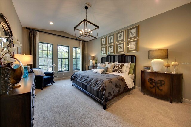 bedroom featuring a chandelier, carpet flooring, and lofted ceiling